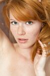 Redheaded teen with nice boobs Mia Sollis poses naked in a solo