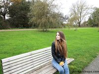 Long-haired teen in a leather jacket puts a hard dick in her mouth in a park