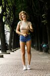 Slim amateur Sylvia Belotti poses in tight denim shorts & a crop top outdoors